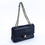 Chanel Black Quilted Chevron Motif Leather Double Flap Bag 23. Gold tone hardware. The interior of