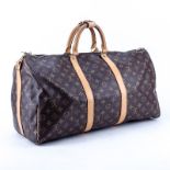 Louis Vuitton Keepall Bandouliere 50. Coated monogram canvas. Golden brass hardware. The interior o