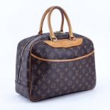 Louis Vuitton Brown Monogram Coated Canvas Deauville Bag. Golden brass hardware, vachetta handle. B