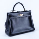 Hermes Black Kelly Retourne 35 Smooth Calf Leather Bag. Gold tone hardware. Leather interior with z