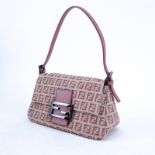 Fendi Beige And Pink Monogram Canvas Baguette Mini Handbag. Antique pink leather straps and closure