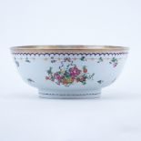 Early Chinese Export Pottery Bowl. Made for the European market and decorated with a floral motif.