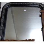 A late Victorian black painted wall mirror, h.