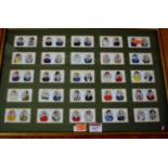 A framed display of Ogden cigarette cards depicting jockeys and trainers; one other of jockeys;
