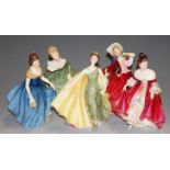 Five Royal Doulton ceramic figures to include Southern Belle HN2229, Autumn Breezes, Soiree HN2312,