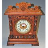 An early 20th century Continental walnut mantel clock