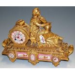 A late 19th century French gilt bronze and pink porcelain inset mantel clock,