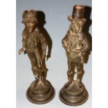 A pair of early 20th century spelter figural candlesticks