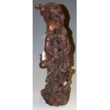 A 20th century Chinese stained rootwood carving of a standing sage (with losses),