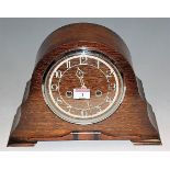 A 1930s oak mantel clock with 8-day movement