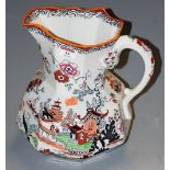 A large Masons ironstone ceramic single handled water jug of typical octagonal faceted form,