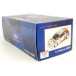 An Action Performance Racing 1/18 scale diecast model of a Ford Focus WRC racing car finished in