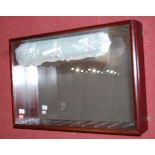 A dark mahogany and glazed front wall hanging display cabinet with various interchangeable glass