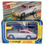 Corgi Toys, 271 James Bond Aston Martin, silver body with red interior, gold radiator and bumpers,