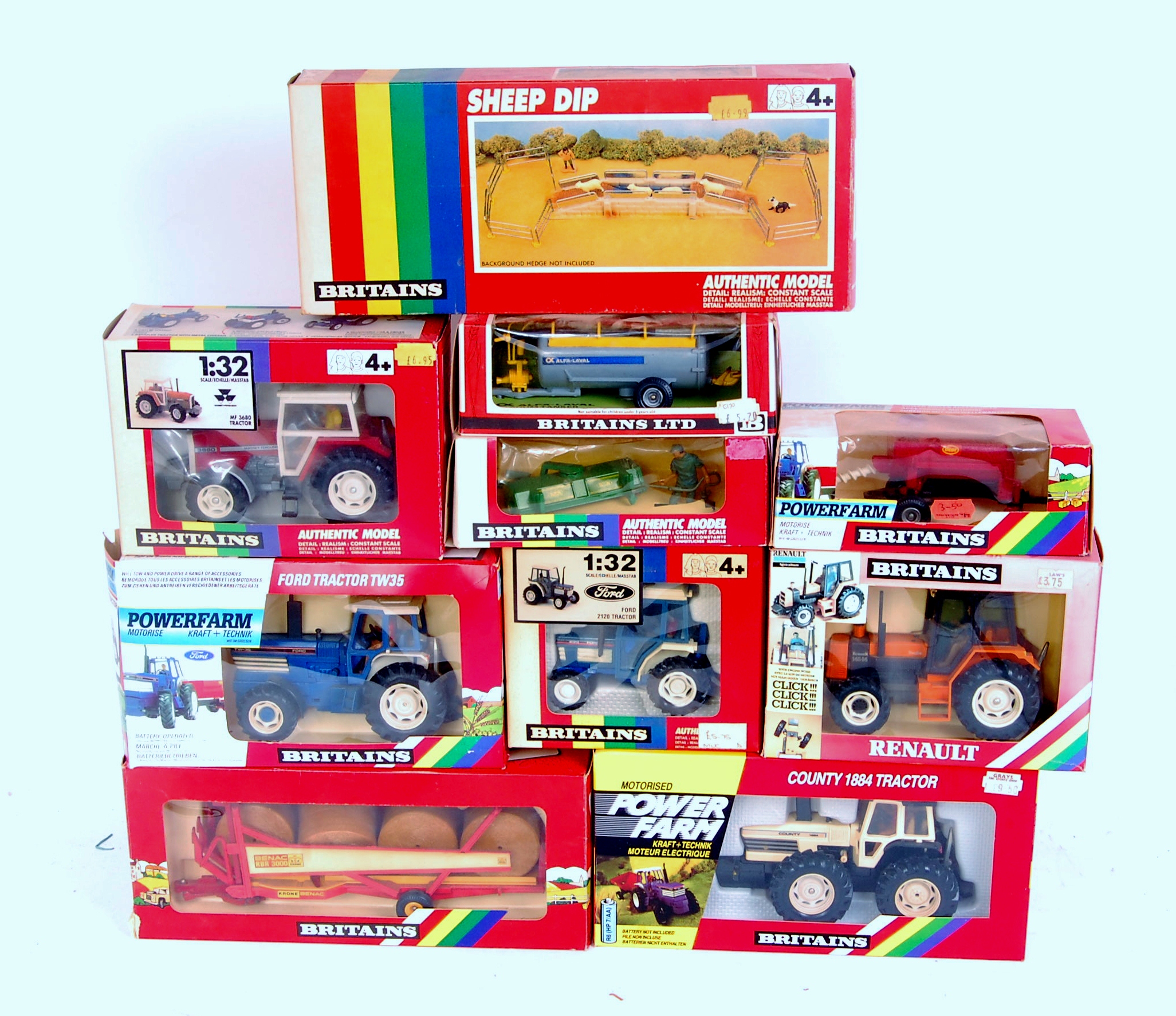 10 various boxed Britains 1/32nd scale Tractors and Farm Implements, all in rainbow window boxes,