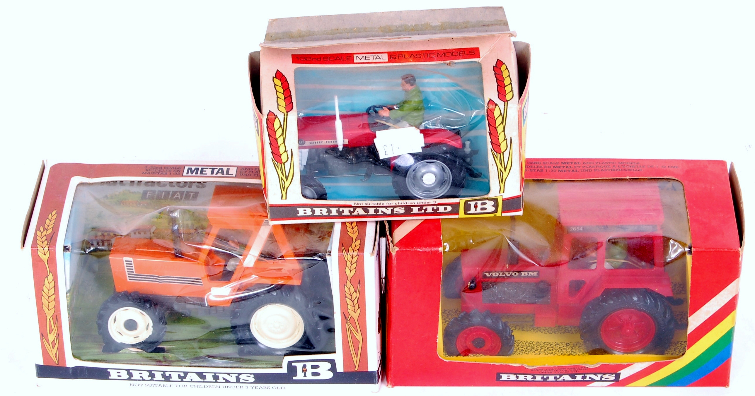 Three various boxed Britains tractors and farm implements, to include; No.