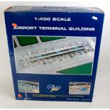 A Gemini Jets 1/400 scale model of an airport terminal building,