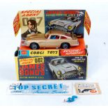 Corgi Toys, 261 James Bond's Aston martin DB5, gold body, red interior with wire wheels,