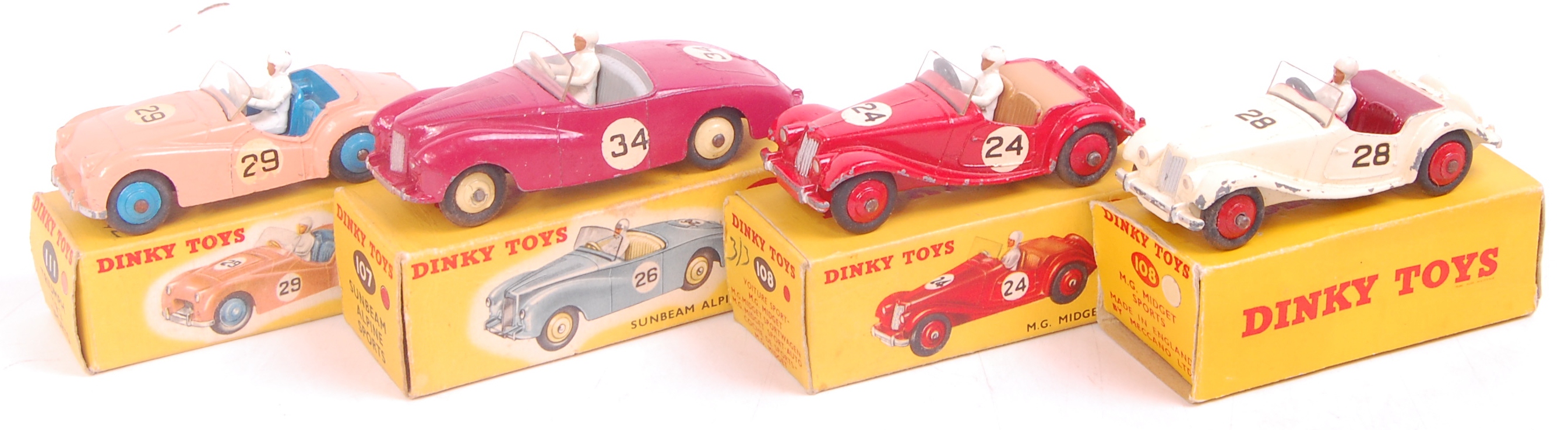 Dinky Toys Boxed Sports Saloon Group, 4 examples, to include No.111 Triumph TR2 Sports (G-BG), No.