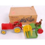 A boxed Charbens farm series farm reaper comprising of red diecast tractor with yellow hubs,