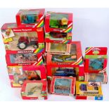 14 various boxed Britains 1/32nd scale Tractors and Farm Implements, all in rainbow window boxes,