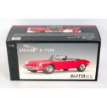 Auto Art Millenium 1/18th scale diecast model of a Jaguar E-Type, finished in red,