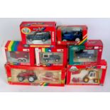 Seven various boxed Britains modern release tractors and farming implements,