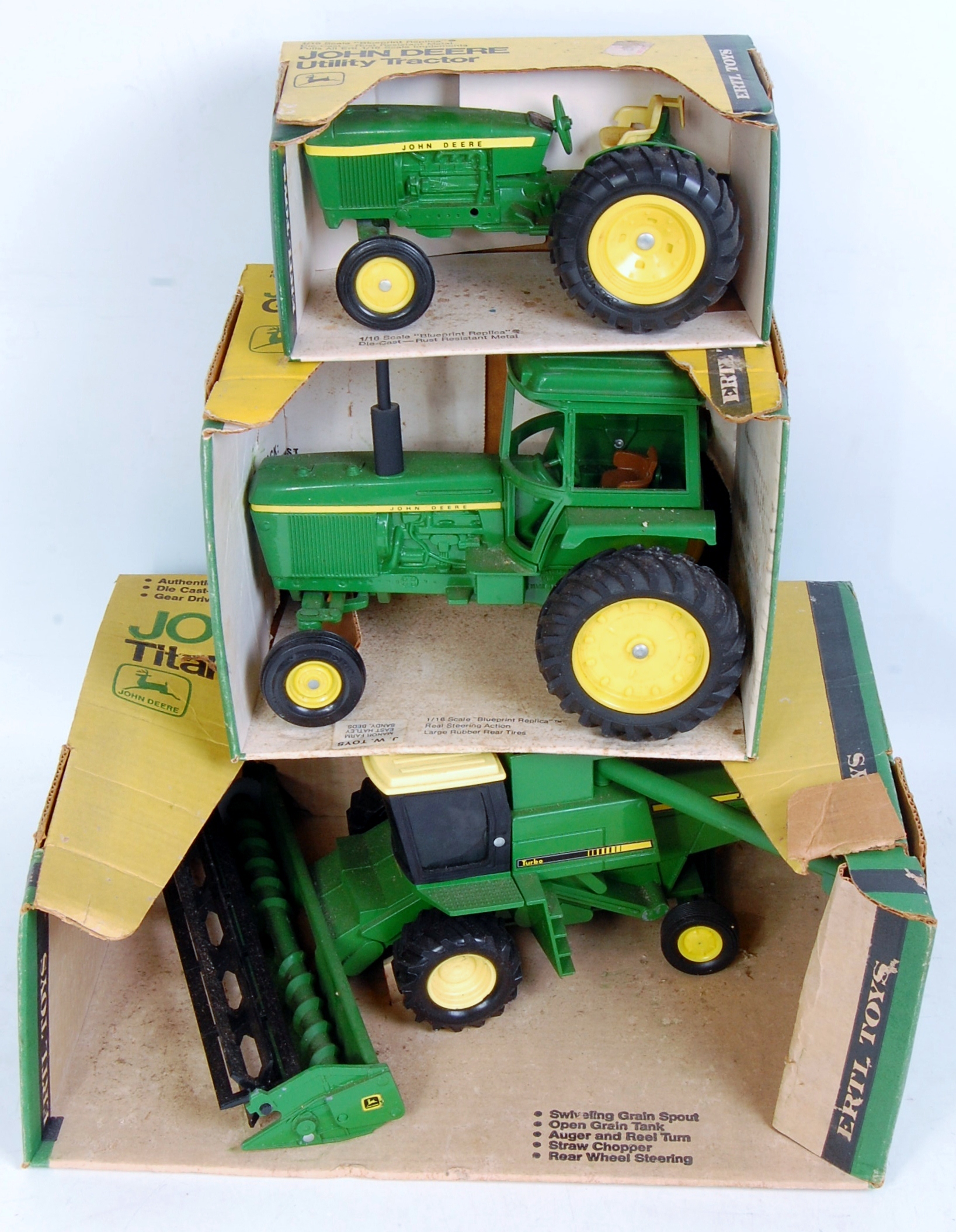 Three boxed ERTL large heavy pressed steel and diecast John Deere tractor and combine groups,