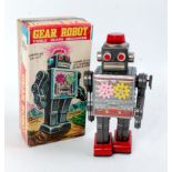 SH Toys of Japan, tinplate and clockwork operated Gear Robot, grey/silver body with red feet,