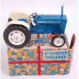 A Maxwell Company of Calcutta diecast model of a Ford 3600 tractor finished in blue and white with