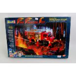 A boxed Revell 1/24 scale plastic kit for Mercedes Benz Unimog U1300L fire tender with action
