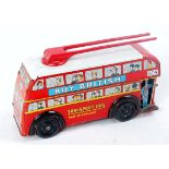Wells Brimtoy large tinplate trolley bus, red with white roof and detailed tinprinted sides,