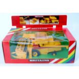 A Britains No.9575 boxed as issued New Holland combine harvester, model No.