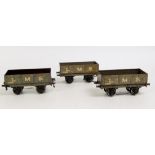 3x Bassett-Lowke prewar grey LMS open wagons, one missing a buffer,