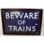 BR enamel sign 'BEWARE OF TRAINS' white on blue ground,