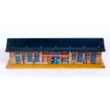 Bing 'Victoria Station' on yellow 15"x4 1/2" base and blue tiled roof,