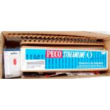 A box of Peco accessories including 3x right hand turnouts and one left hand, 6x point motors,