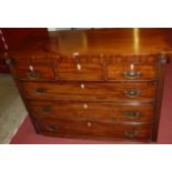 An early 19th century mahogany bowfront chest of three short over three long drawers,