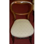 A set of six Victorian beech balloon back salon chairs each having cream floral upholstered stuff