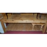 A modern pine round cornered farmhouse style kitchen preparation table raised on square supports to