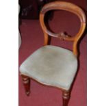 A set of three Victorian mahogany balloon back dining chairs