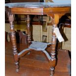 An Edwardian oak shaped top two-tier occasional table,
