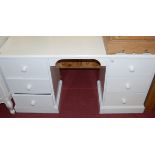 A modern white painted pine round cornered kneehole dressing table,