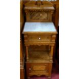 A good late Victorian pitched pine and marble topped ledgeback washstand,