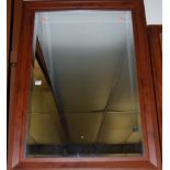 A reproduction cherrywood framed and bevelled wall mirror,