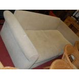 A contemporary upholstered three seater sofa