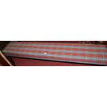 A Victorian style mahogany and chequer upholstered long window seat on turned supports,