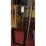 A contemporary iron and rattan clad freestanding wine rack, width 46cm,