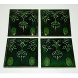A collection of six Art Nouveau green glazed ceramic tiles 15x15cm
