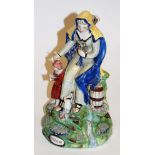 An early 19th century Walton pearlware figure of The Widow of Zarephath,